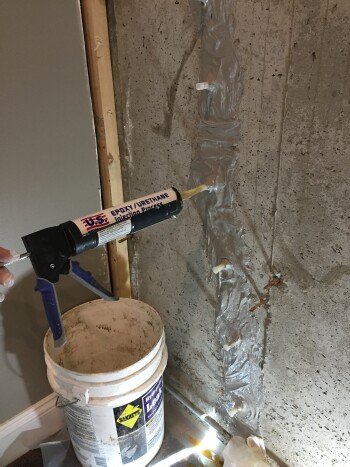 Filling basement crack with resin
